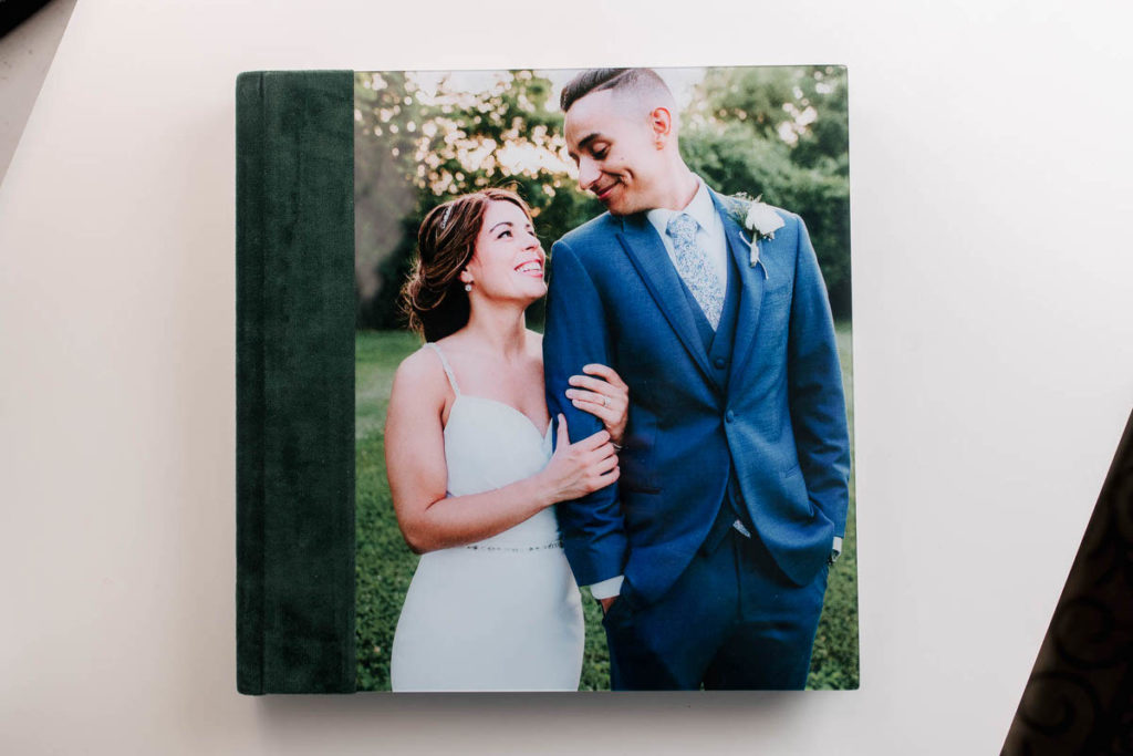 bride and groom on the cover of a wedding album