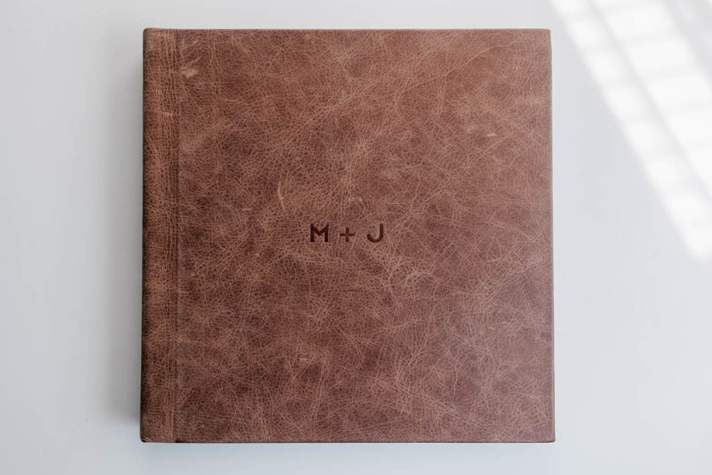 front cover of an album with M plus J engraved on it