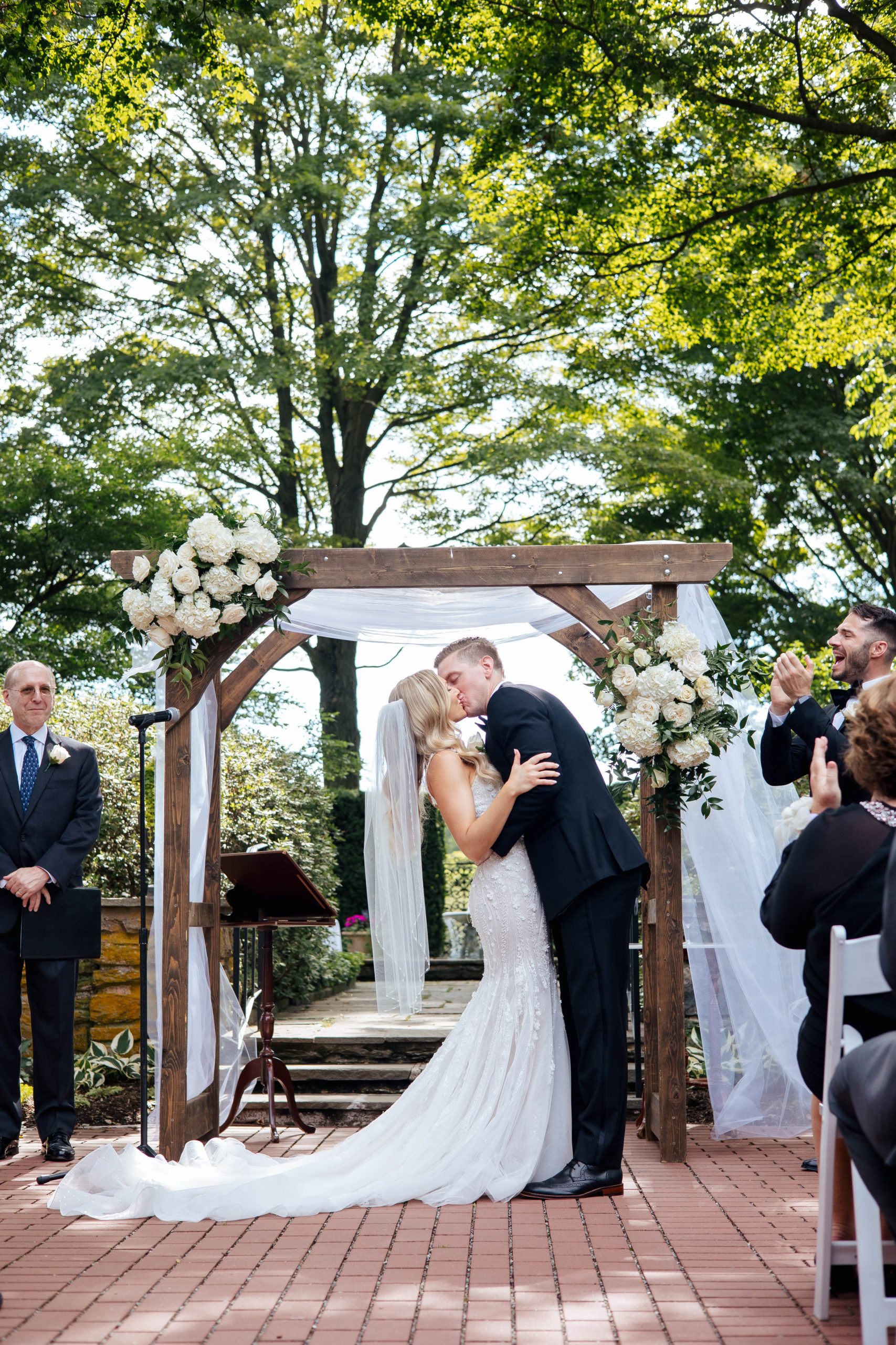 bride and groom during their first kiss 